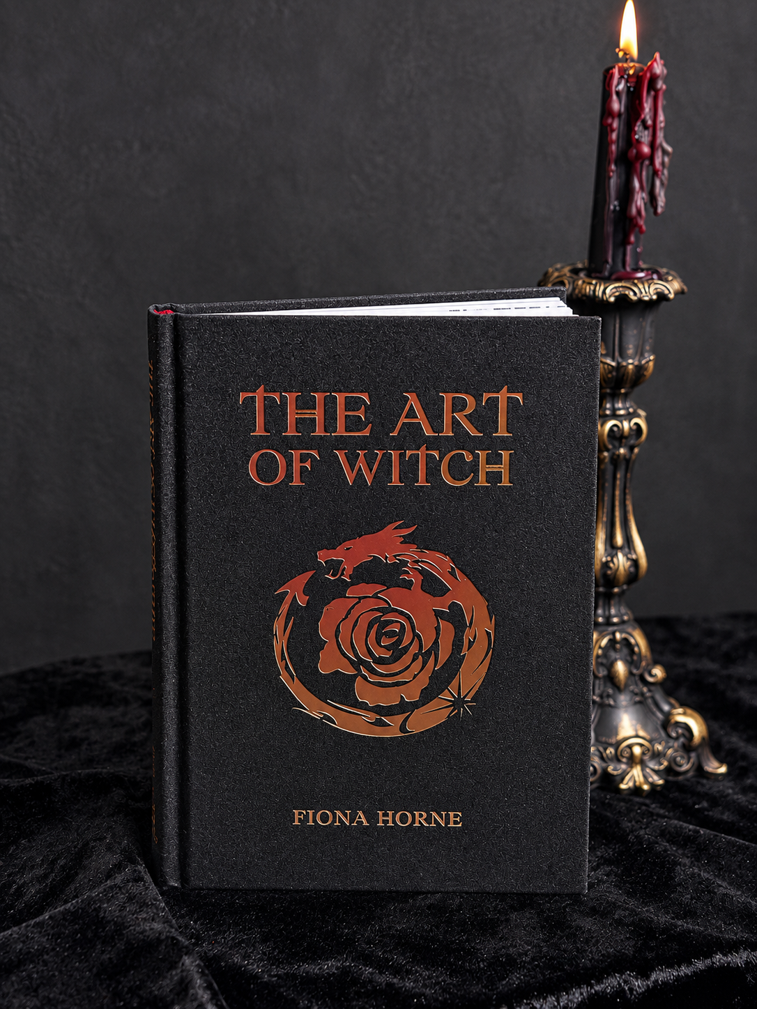 The Art of Witch by Fiona Horne, black textured hardback book featuring copper-coloured lettering and an ornate circular rose design.