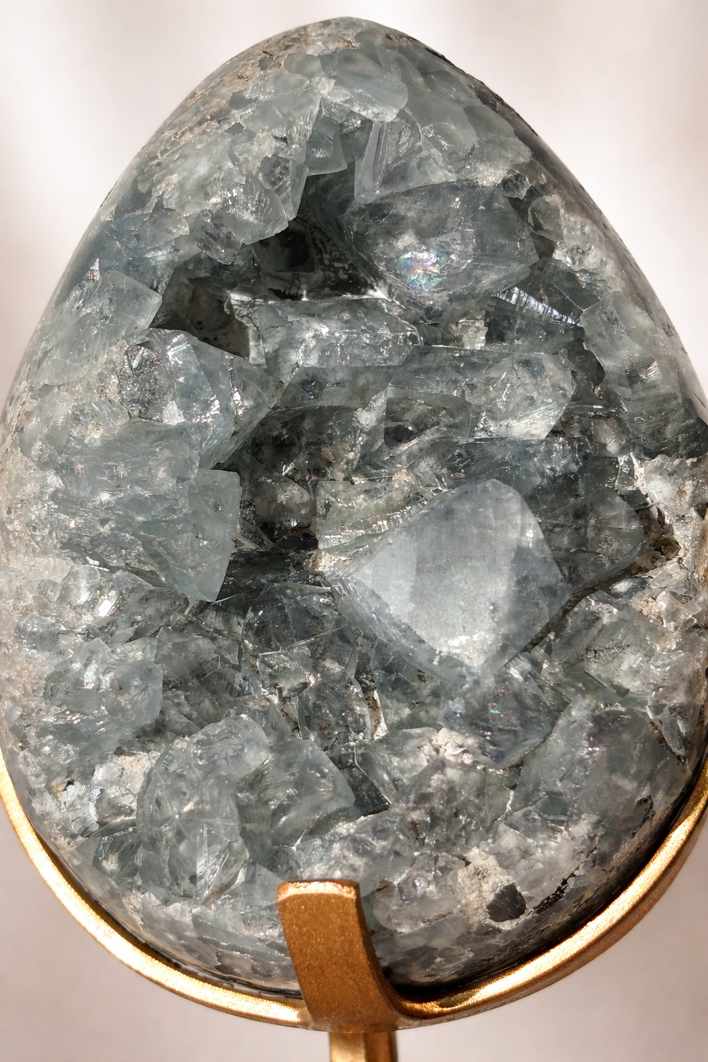 Celestite Egg on Gold Stand – Deep Blue with Rainbow Inclusions