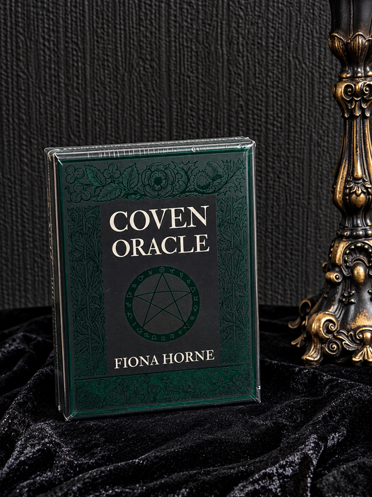 Coven Oracle by Fiona Horne, dark forest green and black oracle deck box featuring ornate botanical borders and a central pentacle design.