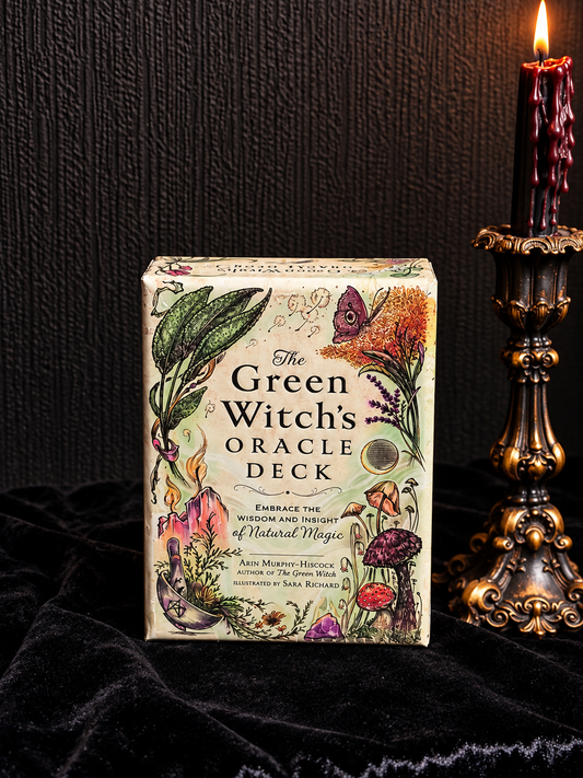 The Green Witch's Oracle Deck by Arin Murphy-Hiscock featuring botanical illustrations of herbs, mushrooms, flowers and crystals on the box.