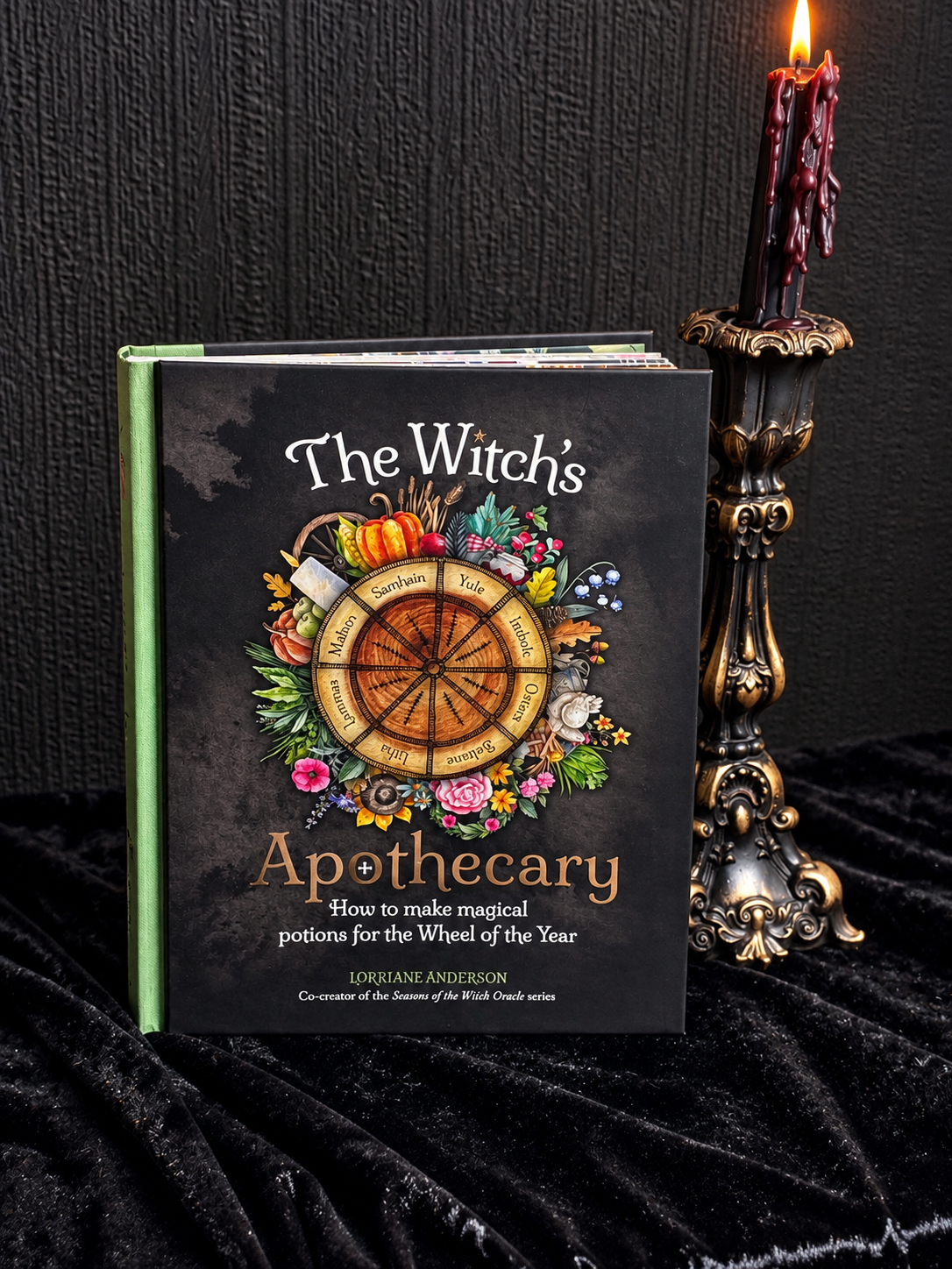 he Witch's Apothecary by Lorraine Anderson, hardcover book featuring an illustrated Wheel of the Year surrounded by flowers, herbs and seasonal botanical imagery.