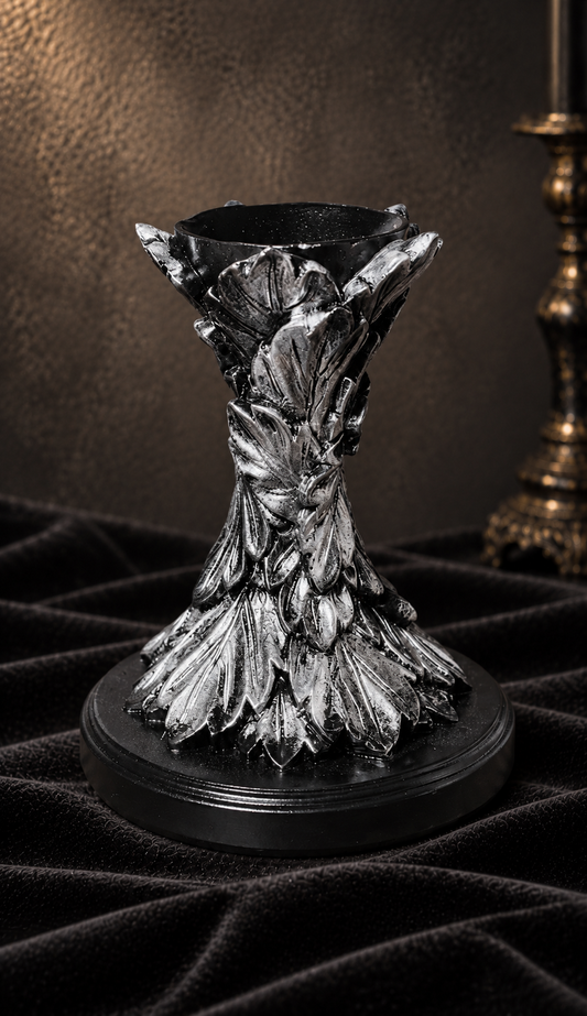 Victorian Botanical crystal sphere stand in black and silver, featuring intricately sculpted overlapping leaves, an elevated sphere cradle and rounded base.